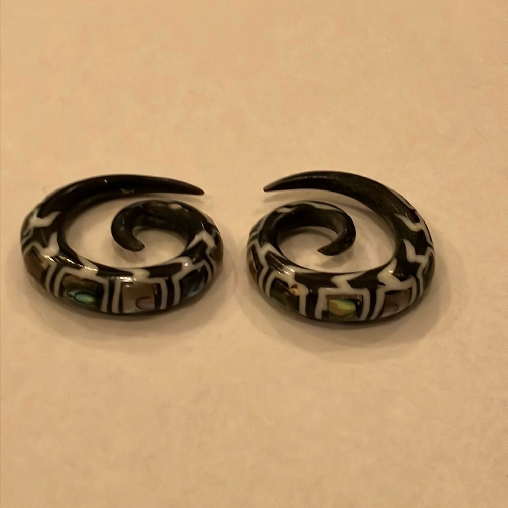 Spiral tribal gauged #2 earring with mother of pearl inlay.